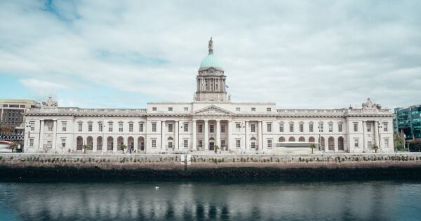A scenic view of the historic Custom House reflecting in the River Liffey in Dublin, Ireland.