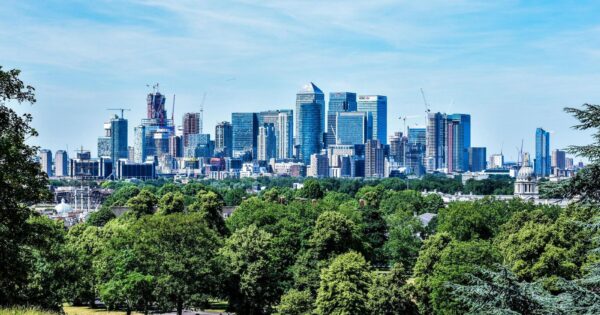 Stunning view of London skyline with greenery from Greenwich Park.