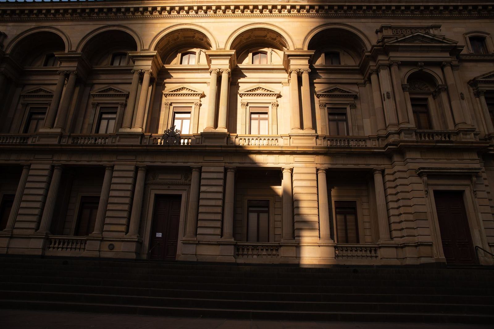 Capture of a historic building facade in Melbourne during daylight, showcasing classic architecture.
