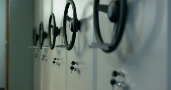 Close-up of industrial safes with manual locks and keys, highlighting security features.
