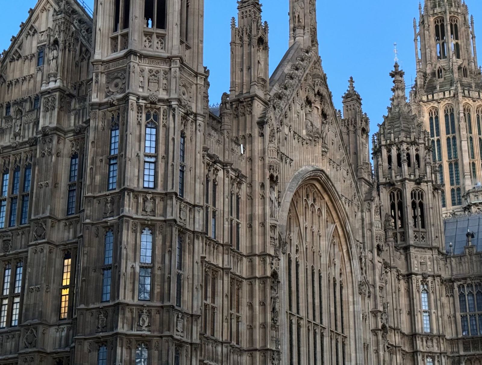 Close-up view of the intricate Gothic architecture of Westminster Palace in London.