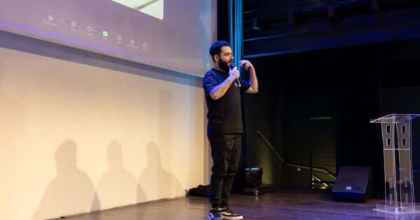 Energetic speaker delivering a talk at a corporate event